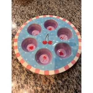 Certified International ceramic cupcake server featuring cherry and heart design